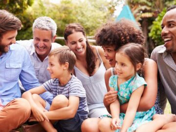 group of people sitting together and laughing