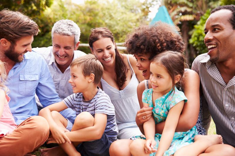 group of people sitting together and laughing